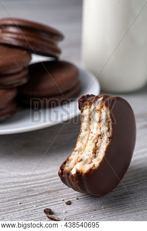 Tasty Bitten Choco Pie On White Wooden Table, Closeup View