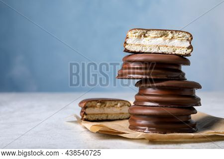 Stack Of Tasty Choco Pies On Grey Table. Space For Text