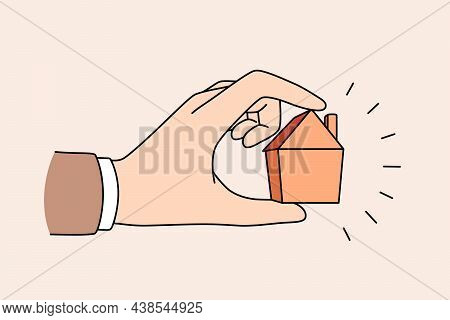 Real Estate And Apartment Concept. Human Hand Holding Little Tine House Apartment For Sale Or Rent V