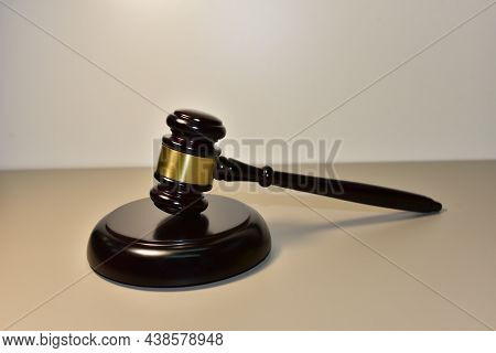 Judge Hammer On Wooden Background. Justice Concept In Courtroom. Mallet Of Judge On Law Theme And Le