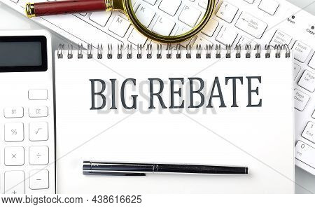 Big Rebate Text On Notepad With Calculator And Keyboard,business