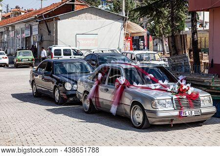 Kemer, Turkey - 08. 25. 2021: Wedding Car Old Mercedes Benz E-class W124 And W210 In Front Of Church