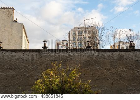 Paris, France - November 3rd 2019: Urban Landscape Behind A Wall - Square Henri-karcher