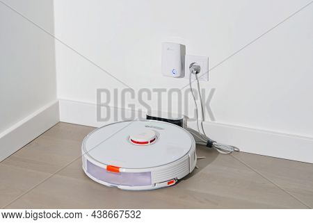 Tallinn, Estonia - October 10, 2021: Xiomi S7 Roborock Vacuum Cleaner On Charging Dock Station. Clos