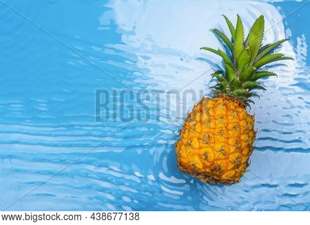 Fresh Pineapple In Water. Fresh Ripe Pineapples Floating In Pure Water In Swimming Pool. Hello Summb