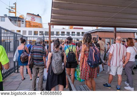 Kinaliada, Istanbul, Turkey - 07.30.2021: A Group Of Passengers Waiting For Vapur Ship In Ferry Term