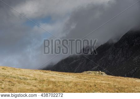 Epic Mountain Landscape Image Of Pen Yr Ole Wen In Snowdonia National Park With Low Cloud On Peak An