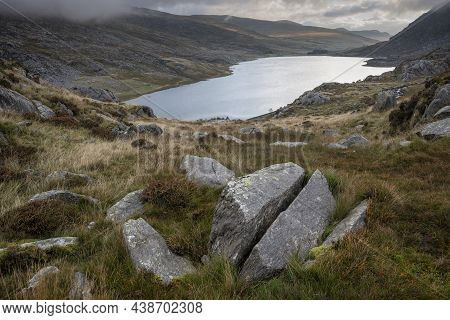 Epic Early Autumn Fall Landscape Of View Along Ogwen Valley In Snowdonia National Park Under Dramati