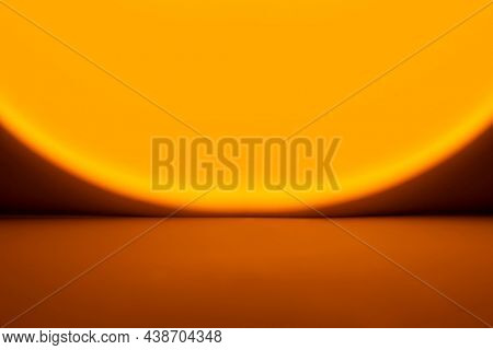 Yellow light background with sunset projector lamp