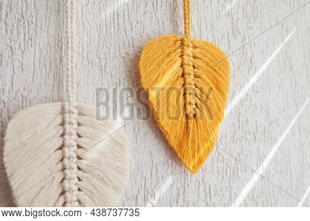 Macrame Leaves Wall Hanging In Yellow, White And Green  And Natural Color On The Wooden Stick. Cotto