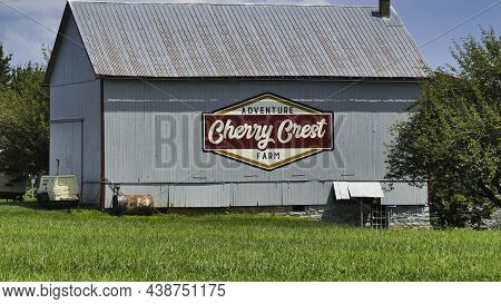 Ronks, Pennsylvania, August 2020 - An Amish Barn With A Sign On It In The Countryside As Seen On A B