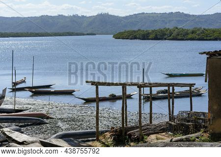 Canoes And Boats Docked On The Bank Of The Grand Paraguacu River.