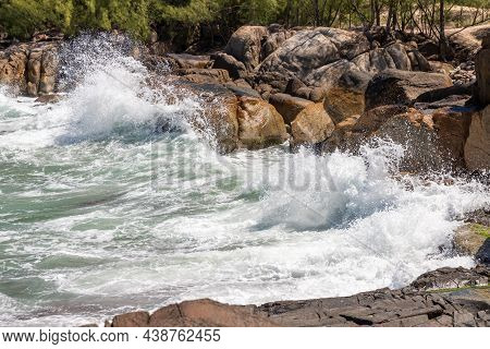 Wave Splash And Rocks