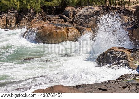 Wave Splash And Rocks