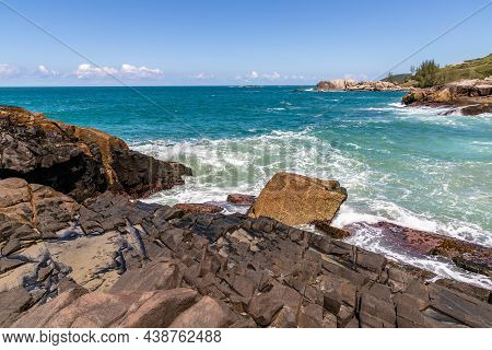 Rocks, Waves And Sand On The Beach