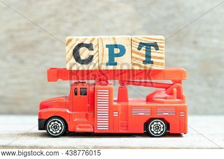 Fire Ladder Truck Hold Letter Block In Word Cpt (abbreviation Of Carriage Paid To) On Wood Backgroun