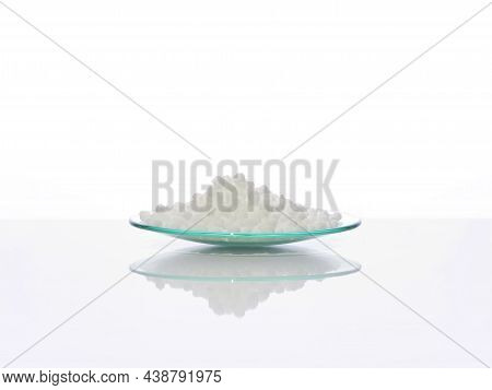 Carbamide In Chemical Watch Glass. Close Up Chemical Ingredient On White Laboratory Table. Side View