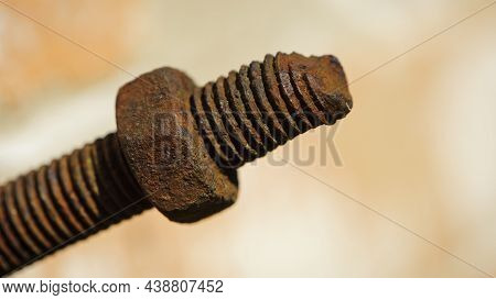 Old Rusty Bolt, Iron Rod With Screw Threads. Rusted Mechanical Components. Threaded Bolt And Nut Iso