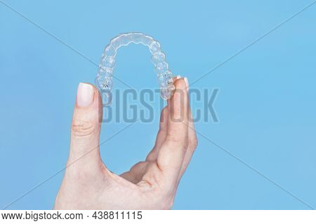 Hand Holding Removable Invisible Transparent Aligner Invisalign Or Plastic Orthodontic Braces Retain