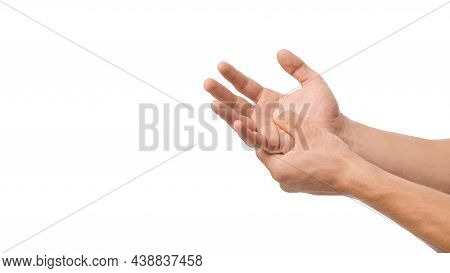 Unrecognizable Millennial Caucasian Male Presses His Hand To Sore Spot And Suffers From Pain In Arm