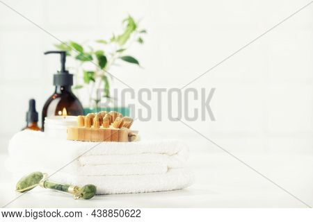 Spa And Bathroom Accessories On White Bathroom Countertop Against Tile Wall - Lymph Drainage And Lym