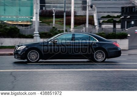 Moscow, Russia - October 2021: Side View Mercedes Benz S350d 4matic Moving On Wet Slippery City Road