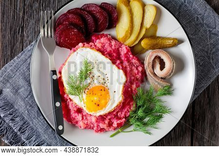 Labskaus, Corned Beef, Mashed Potatoes With The Beetroot Topped With Fried Eggs, Sliced Beets, With 