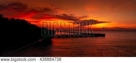 Beautiful Red And Orange Sunset Sky Over The Tropical Sea. Red Sunset Sky. Skyline At The Sea. Tropi
