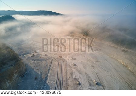 Aerial View Of Open Pit Mining Site Of Limestone Materials Extraction For Construction Industry With