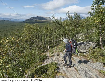 Man Backpack Hiker At Kungsleden Trail Admiring Nature Of Sarek In Sweden Lapland With Mountains, Ro