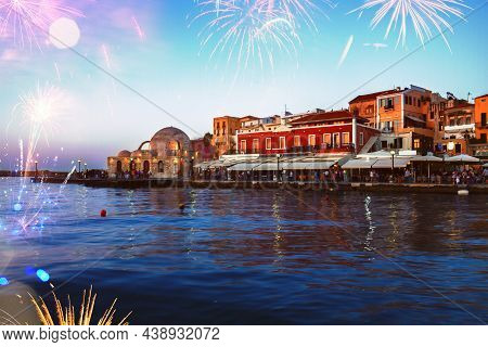 Embankment And Venetian Habour With Turkish Mosque Yiali Tzami Of Chania With Fireworks, Crete, Gree
