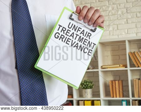 Unfair Treatment Grievance With Clipboard In The Hands.