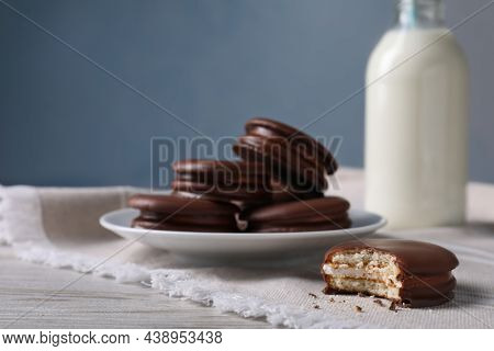 Tasty Choco Pies And Milk On White Wooden Table