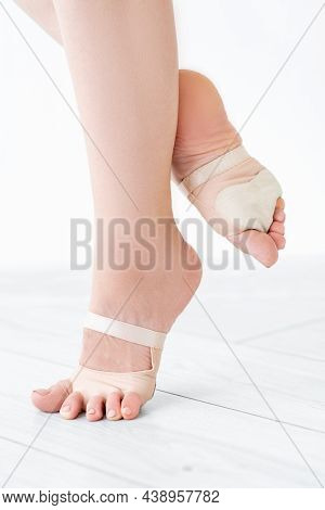 Female Dancer Feet. Professional Sportive Equipment. Unrecognizable Slim Woman In Antislipping Prote