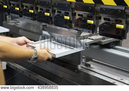 The Technician Operator Working With Hydraulic Press Brake Bending Machine. The Sheet Metal Working 