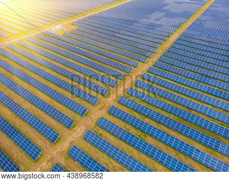 Solar Power Plant In The Field. Aerial View Of Solar Panels.