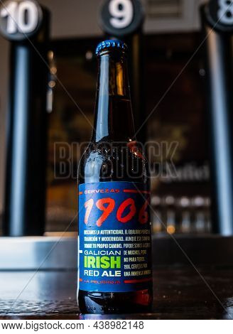 Extremadura, 11.05, 2021. Bottle Of Estrella Galicia 1906 On A Bar Counter. Estrella Galicia Is Prod