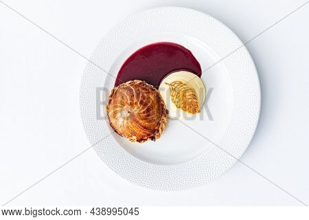 Tenderloin with pork, mushrooms and sirloin puff pastry on a white background. Homemade meal for wellington.