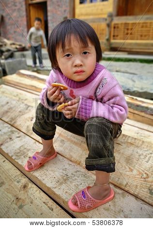 Asian Child Girl 4 Years Old, Holding Cookie, In Countryside.