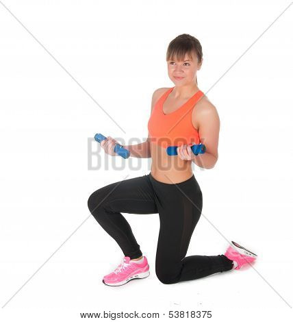 Fitness Woman Exercising With Dumpbells