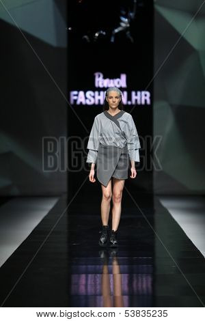 ZAGREB, CROATIA - OCTOBER 17: Fashion model wearing clothes designed by Petra Vuletic and Sasa Hortig on the 'Fashion.hr' show on October 17, 2013 in Zagreb, Croatia.