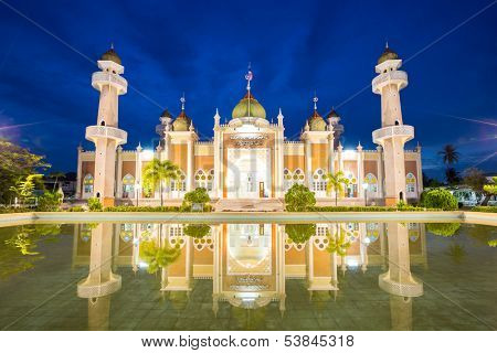 Twilight view of central mosque with reflection in pond, Pattani, Thailand