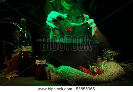  Witch in scary Halloween laboratory on dark color background