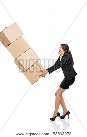 Business woman stumbling with a pile of card boxes on her hands, isolated on white
