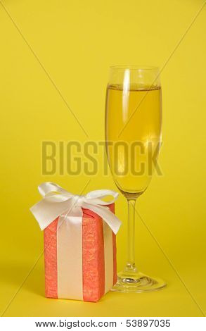 Wine glass, gift box with ribbon and bow