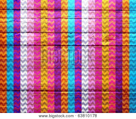 Colorful chevron pattern on wood texture