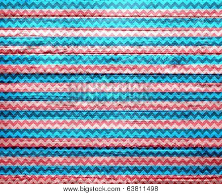 Colorful chevron pattern on wood texture