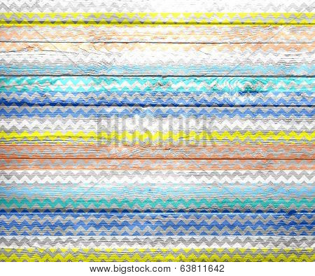 Colorful chevron pattern on vintage wood
