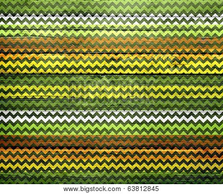 Colorful chevron pattern on wood texture background