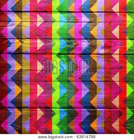 Colorful chevron pattern on wood texture background